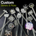 Collection of personalized drink stirrers and custom picks with various custom logos on a dark background. The words Custom stirrers and Picks is on the top left and a "Customize" badge is on the bottom right