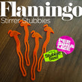 Flamingo Personalized Stubbie Swizzle Sticks on a dark wood background, with large white text reading 'Flamingo Stirrer Stubbies' and two colorful promotional stickers.
