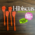 Hibiscus Flower Personalized Stubbie Drink Stirrer with 'Hibiscus' branding on a wooden surface