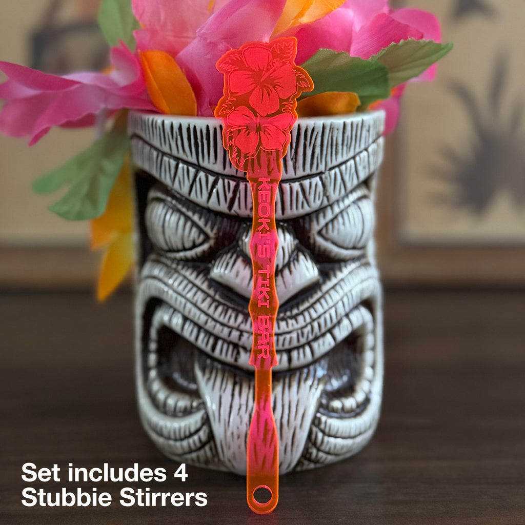 Tiki mug with Hibiscus Flower Personalized Stubbie Drink Stirrer on a wooden surface
