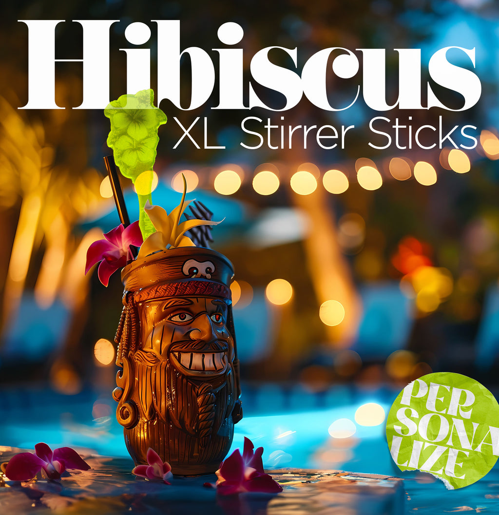 Hibiscus Flower Personalized XL Drink Stirrer. Decorative tiki mug with flowers and 'Hibiscus XL Stirrer Sticks' text against a blurred bokeh background.
