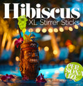 Hibiscus Flower Personalized XL Drink Stirrer. Decorative tiki mug with flowers and 'Hibiscus XL Stirrer Sticks' text against a blurred bokeh background.