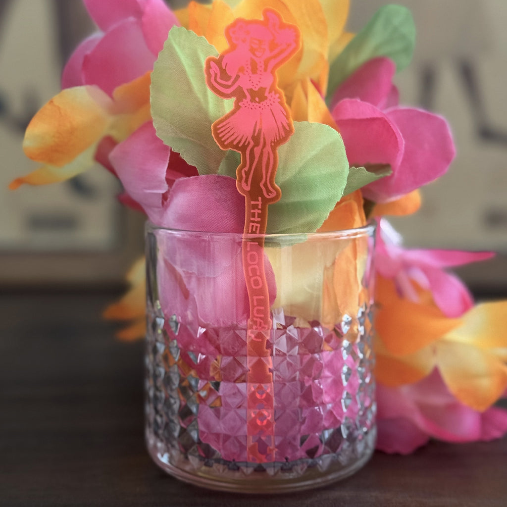 Decorative rocks glass with Hula Dancer "Loco Luau" Personalized Stubbie Swizzle Stick, decorations and flowers.