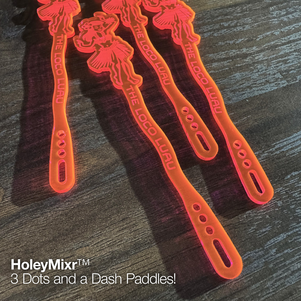 Hula Dancer "Loco Luau" Personalized Stubbie Swizzle Sticks on a dark wooden surface