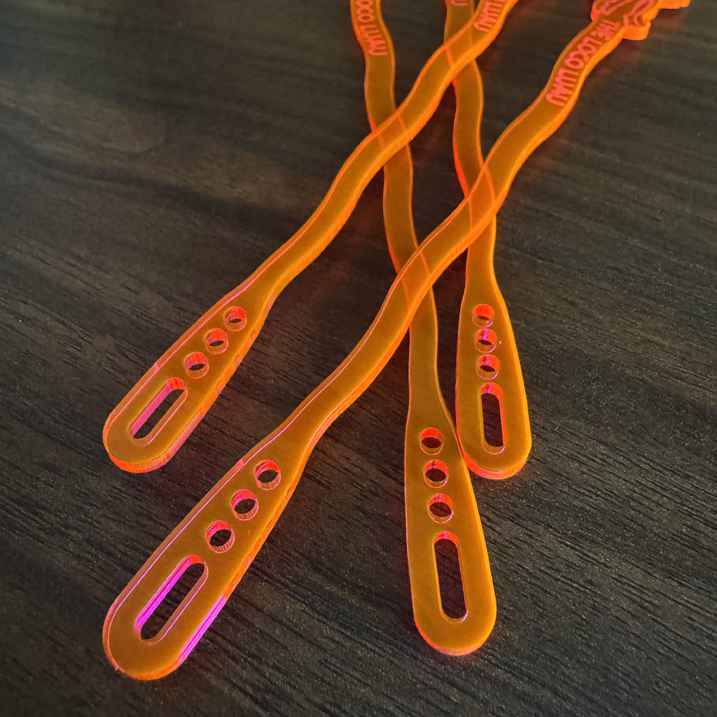 Hula Dancer "Loco Luau" Personalized XL Swizzle Sticks end on a wooden surface