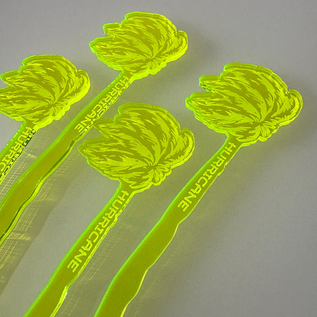 Photo detail of Hurricane Personalized Swizzle Sticks, Custom Palm Tree Tiki Bar Drink Stirrers with wind blown palm tree design on a gray background