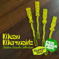 Mean Mermaids Personalized Stubbie Swizzle Sticks arranged on a dark wood surface, with large white text and two colorful promotional badges.