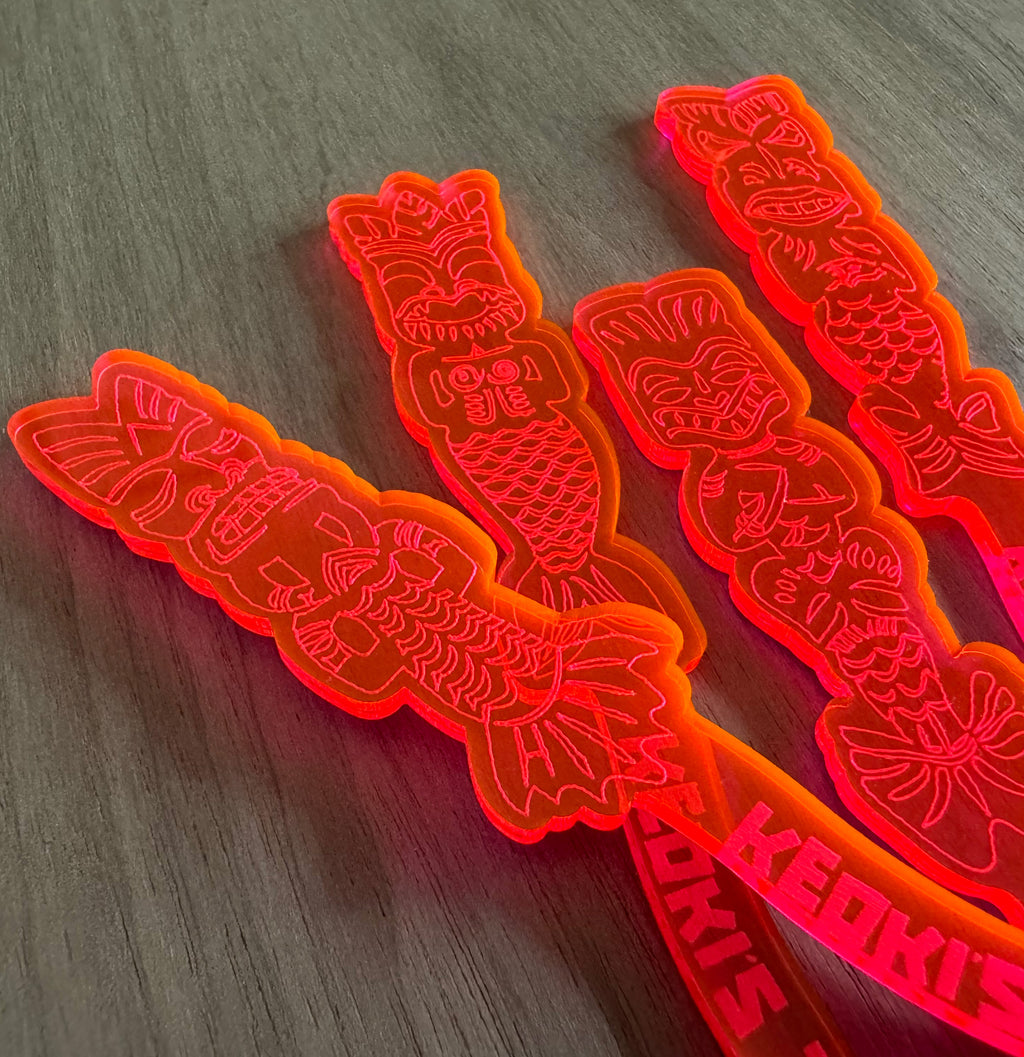 Mean Mermaids Personalized XL Swizzle Sticks on a wooden surface