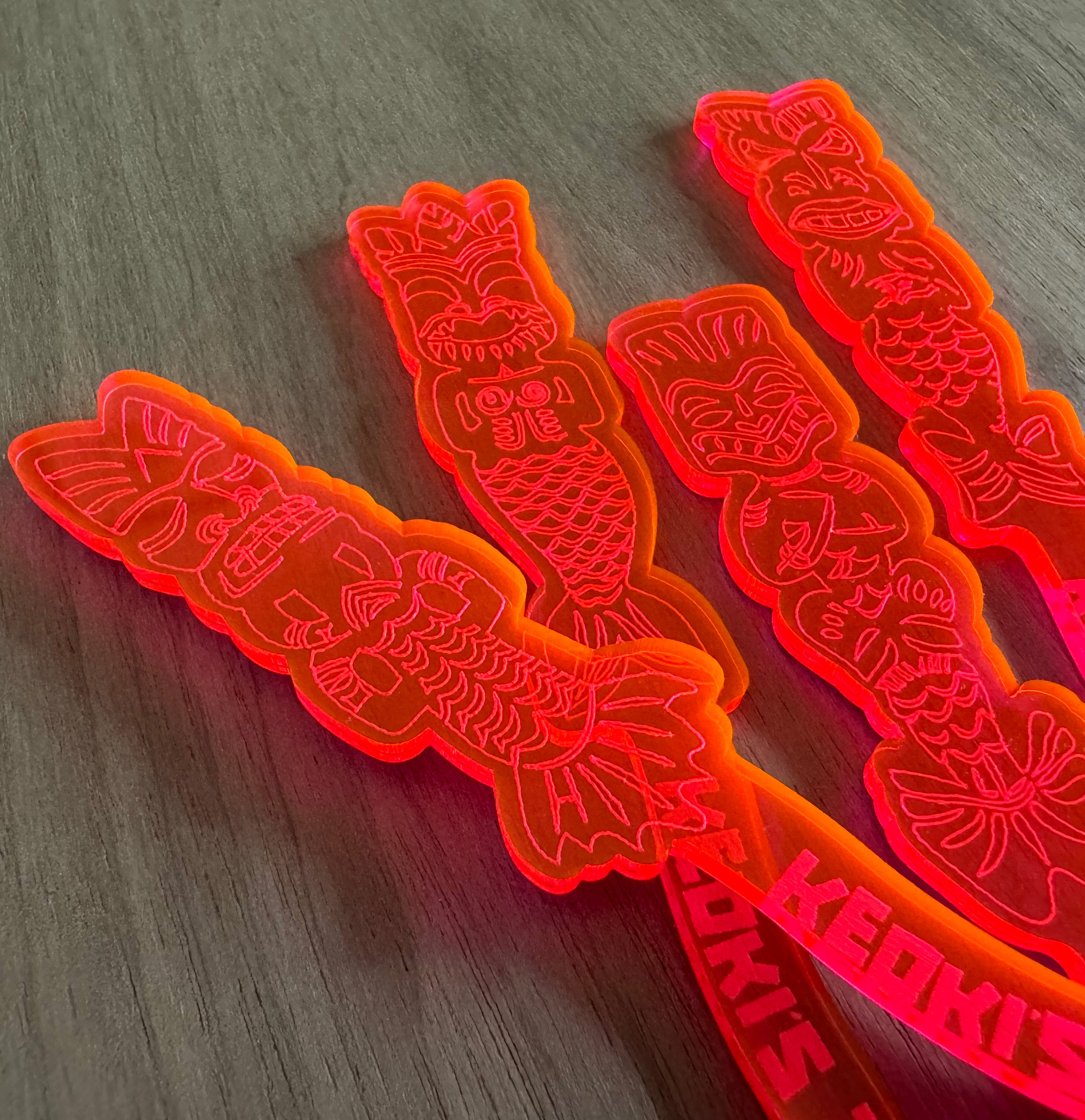 Mean Mermaids Personalized XL Swizzle Sticks on a wooden surface
