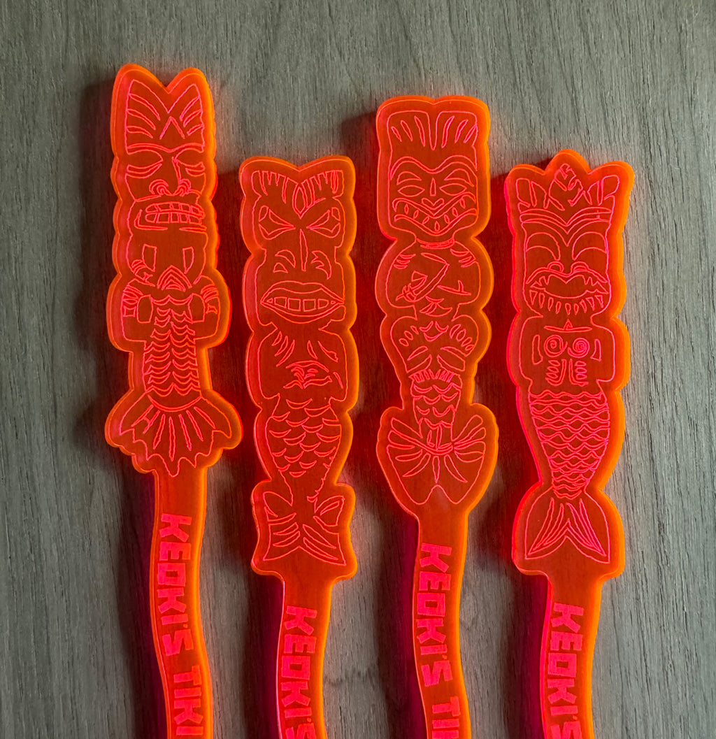 Mean Mermaids Personalized XL Swizzle Sticks tiki-themed drink stirrer sticks on a gray surface