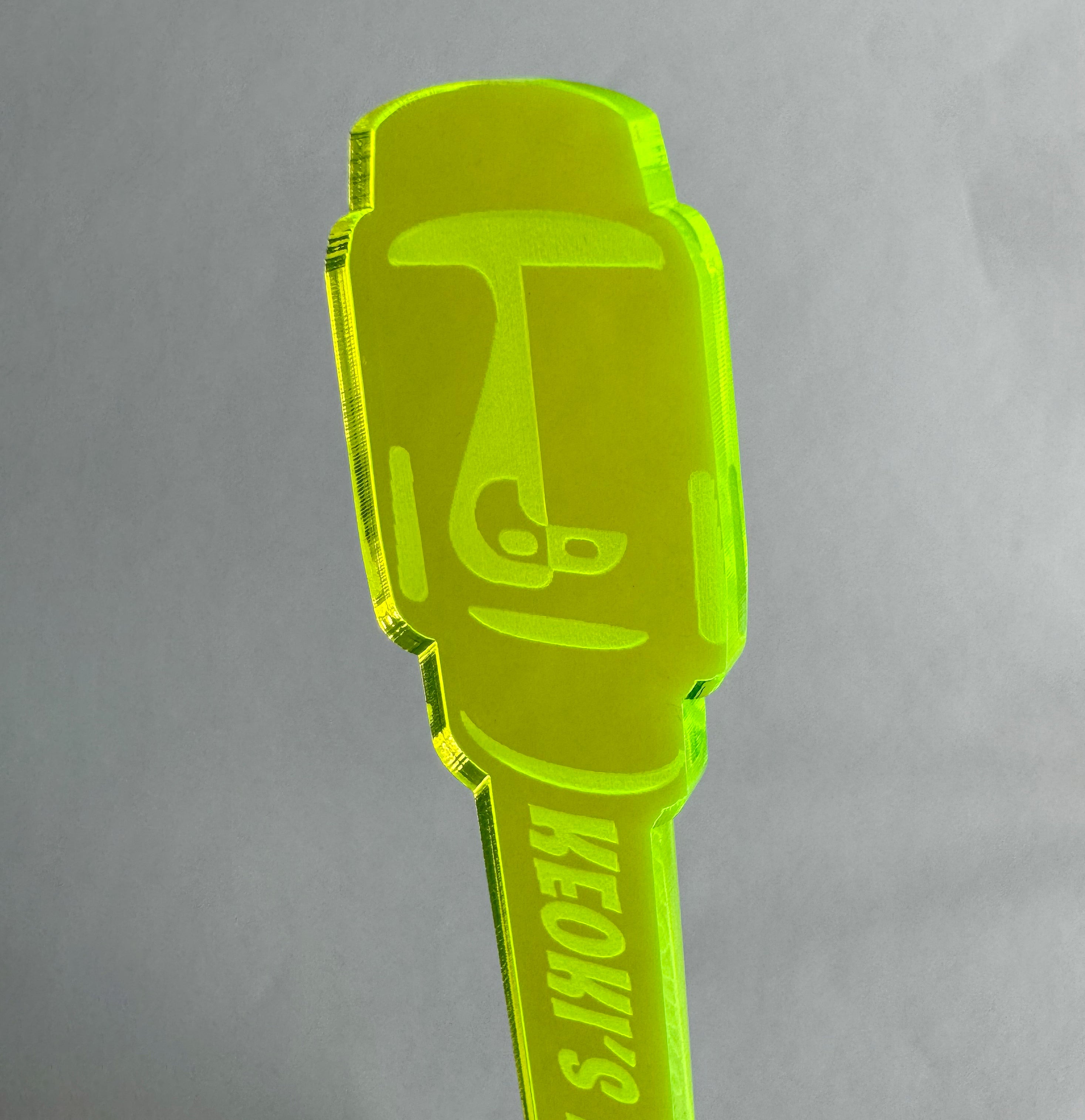 Moai Statue Personalized Swizzle Stick on a gray background