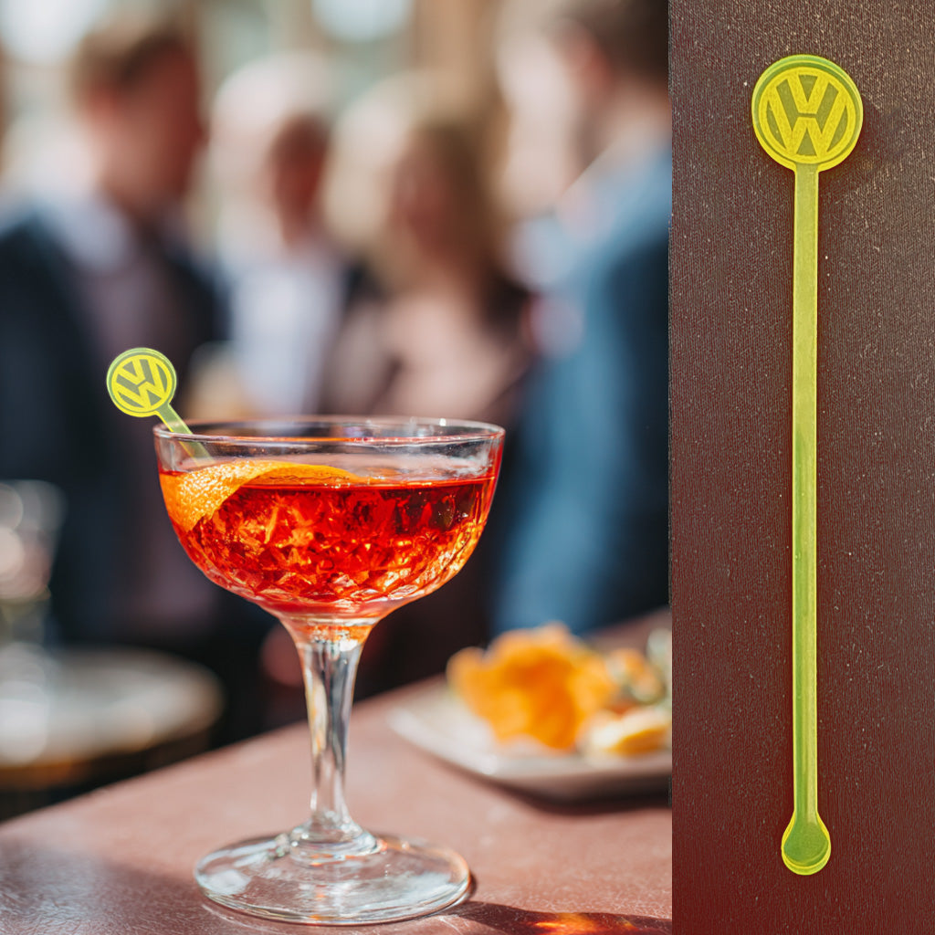 VW (Volkswagen) logo cocktail stirrer in a rocks glass at a corporate trade show reception
