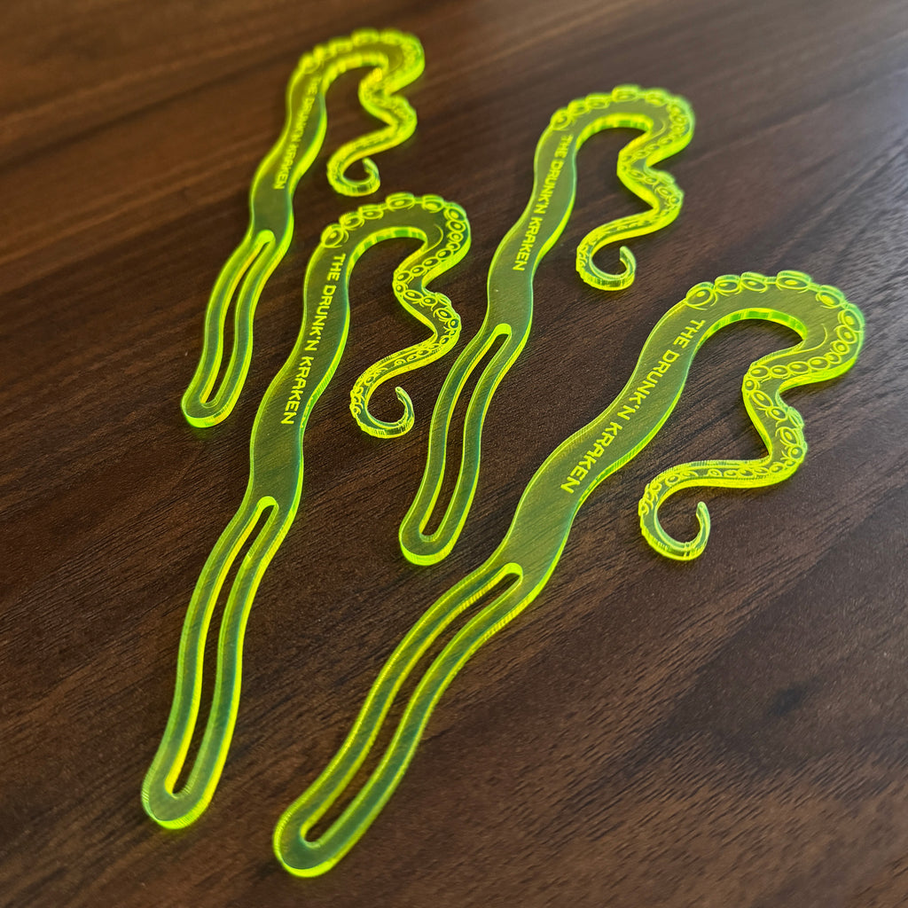 Product Photo of Octopus Tentacle_The Drunken Kraken Personalized Stubbie Swizzle Sticks on a wood table