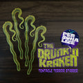 Green octopus tentacle-like design personalized drink stirrer with 'The Drunk'n Kraken' text on a dark background