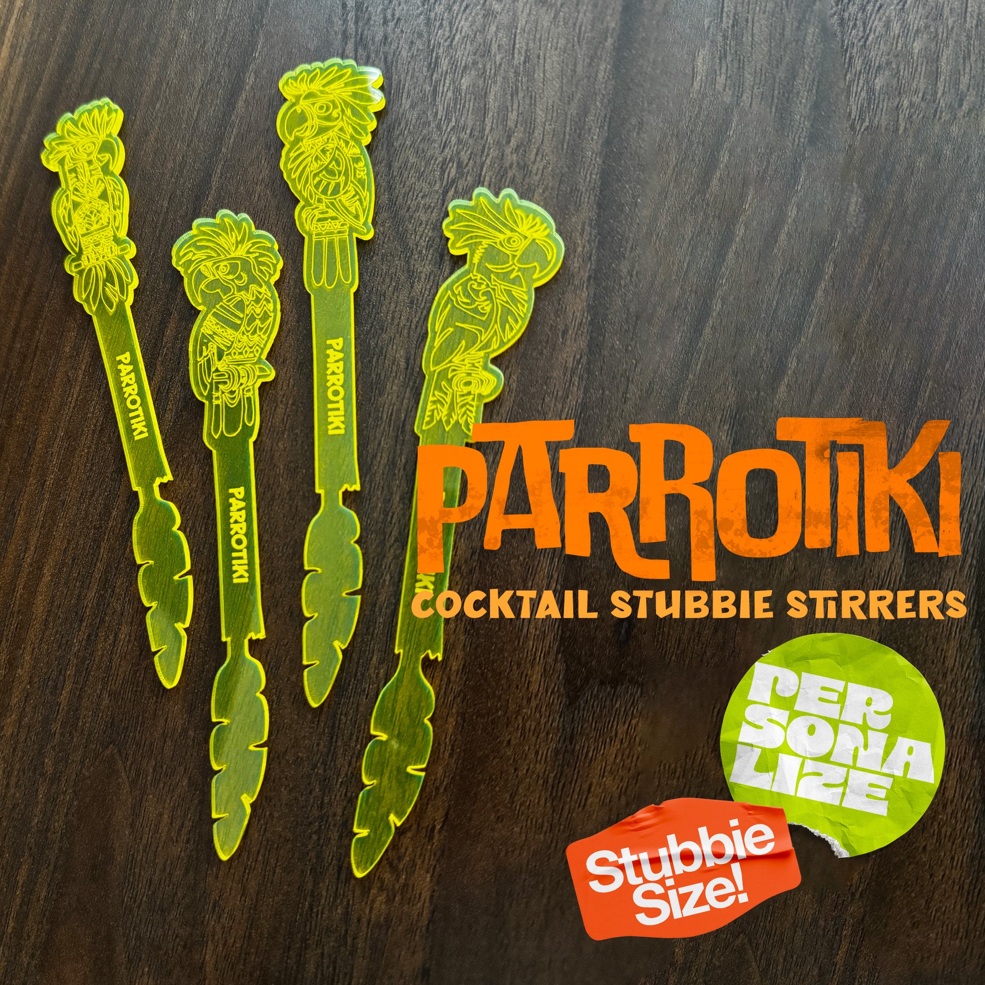 Parrotiki Cocktail Stubbie Stirrer Cover Product image, featuring the 4 drink stirrers on a wood background. The image includes two badges with the test 'Personalize' and 'Stubbie Size'