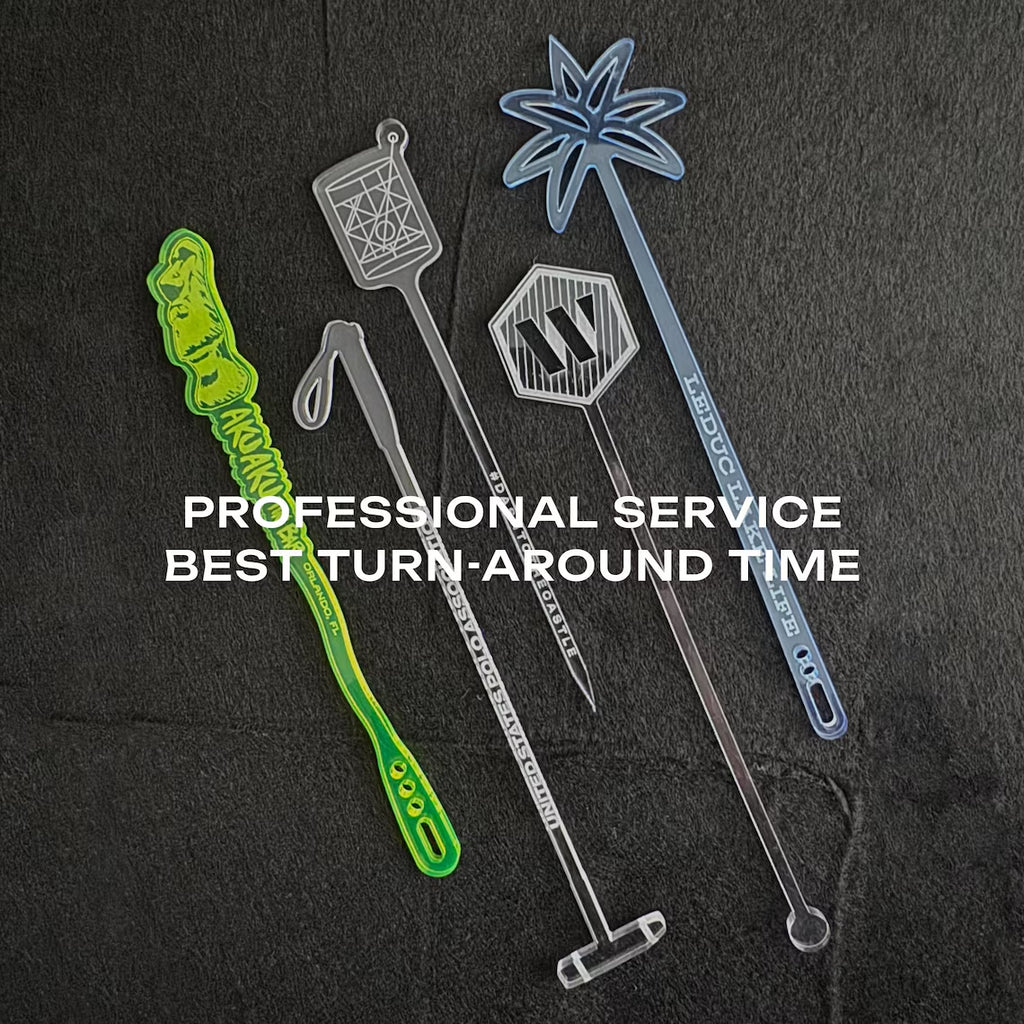 Flat lay of branded acrylic swizzle sticks engraved with company logos for business events