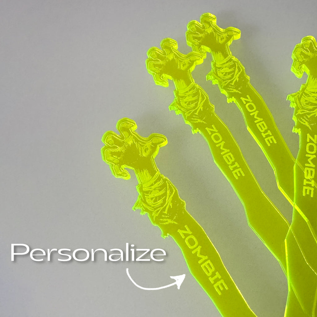 Zombie Personalized Stubbie Swizzle Sticks with 'Zombie' branding on a gray background.