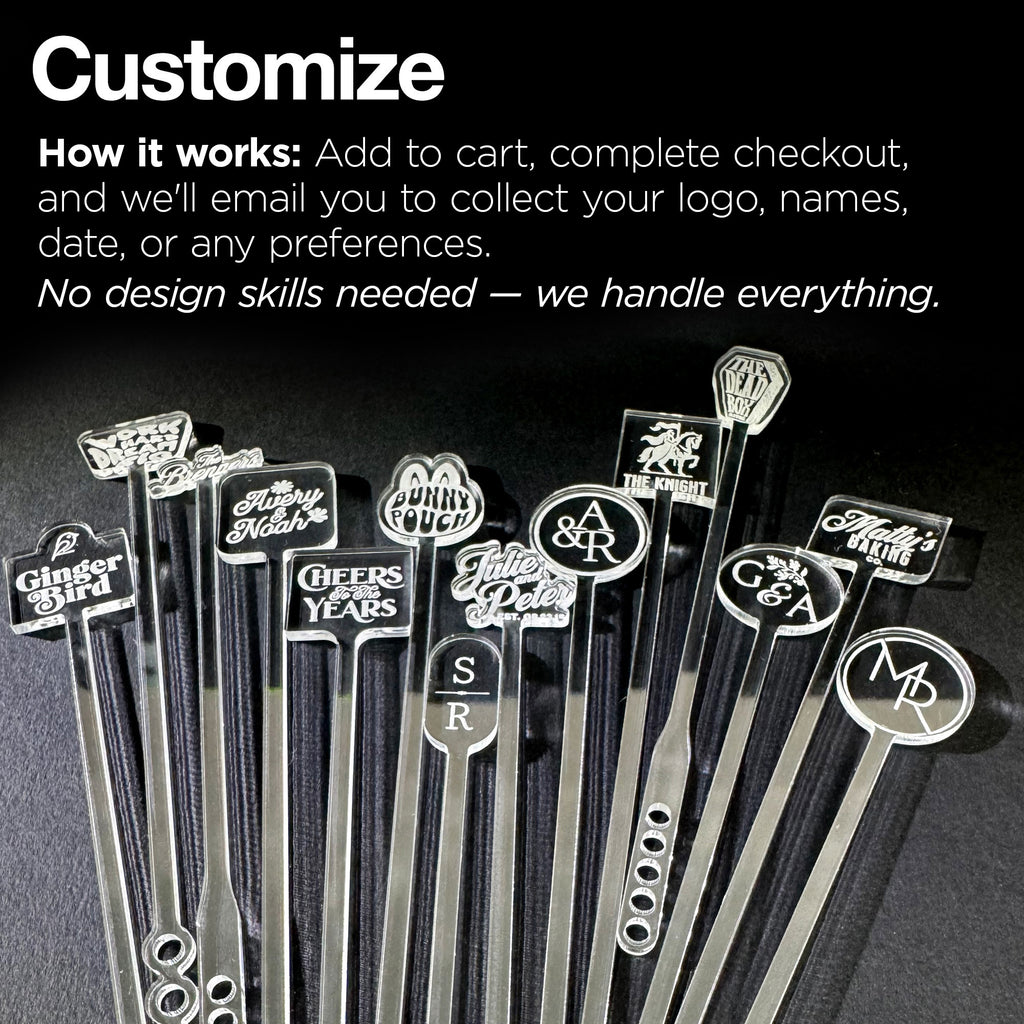 Set of personalized cocktail stirrers with various logos on a dark background
